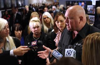 Moonlite Bunny Ranch brothel owner Dennis Hof answers the media questions on Tuesday, Feb. 22, 2011, at the Legislature in Carson City.