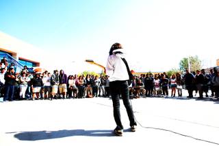 Senior, Marisa Denton, plays the guitar in front of her classmates during the schools courtyard during the Desert Pine High School's talent search Thursday, February 24, 2011 in Las Vegas.