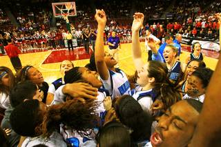 The Centennial girls basketball team and fans celebrate their 71-65 win over Liberty in the state championship basketball game Friday, February 25, 2011 at the Orleans Arena.