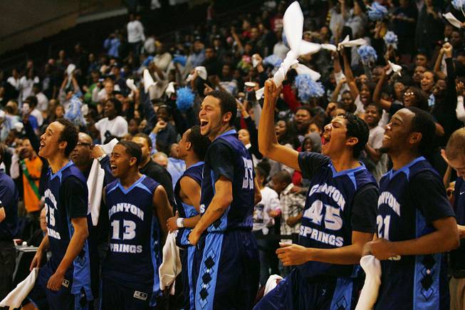Canyon Springs players cheer on their teammates during their game against Bishop Manogue in the boy's state basketball championship game Friday, February 25, 2011. Canyon Springs won 82-47.