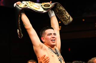 Brandon Rios of Oxnard, Calif., celebrates his victory over WBA lightweight champion Miguel Acosta of Venezuela on Saturday at the Palms. Rios won the title with a 10th round TKO.