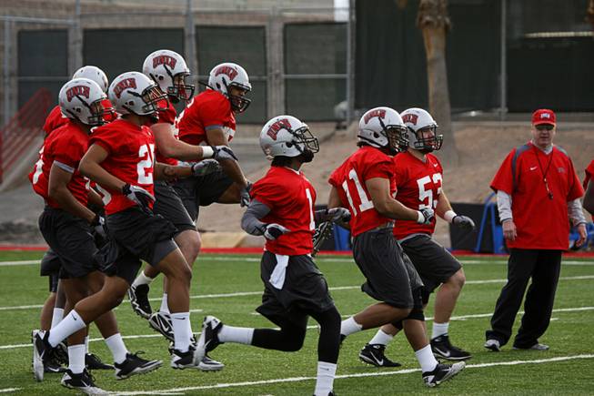 UNLV football players run during the first day of Spring practice at Rebel Park on the UNLV campus Monday, February 28, 2011.