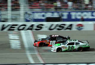 Kyle Busch (18) battles Denny Hamlin for the lead of the NASCAR Nationwide Series Samis Town 300 at the Las Vegas Motor Speedway on Saturday, March 05, 2011.