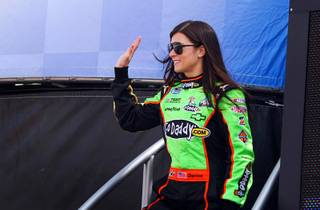 Danica Patrick waves during driver introductions at the Sam's Town 300 NASCAR Nationwide Series race at the Las Vegas Motor Speedway Saturday, March 5, 2011. Patrick finished fourth becoming the highest-finishing woman ever in a national series race and the first to post a top-five finish in a Nationwide Series event.