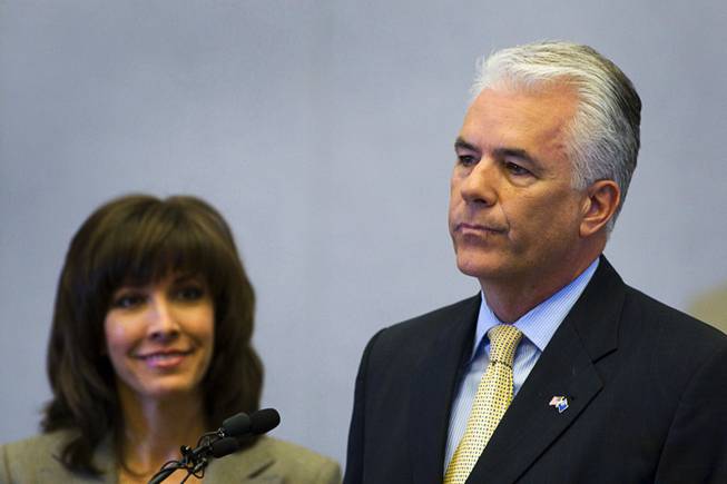 U.S. Sen. John Ensign (R-NV) announces he will not seek another term in 2012 during a news conference at the Lloyd George Federal Building in Las Vegas, Nevada Monday, March 7, 2011.  Ensign's wife Darlene is at left. STEVE MARCUS / LAS VEGAS SUN