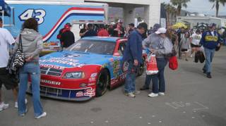 Fans are introduced to the car used in the Richard Petty Driving Experience at LVMS.