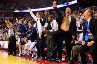 The BYU bench celebrates a successful three-point shot late in their Mountain West Conference Championship game against TCU Thursday, March 10, 2011 at the Thomas & Mack Center. BYU won the game 64-58.