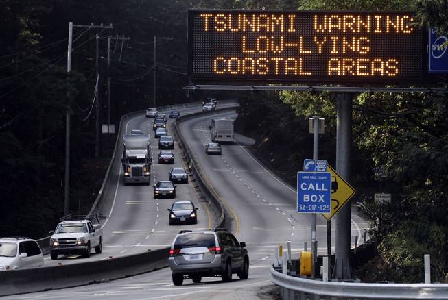 A tsunami warning is flashed along Highway 17 in the mountains leading to the coastal town of Santa Cruz, Calif., Friday, March 11, 2011. An 8.9-magnitude earthquake in Japan sparked a tsunami that moved across the Pacific triggering warnings as far away as the U.S. west coast. 