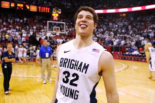 BYU guard Jimmer Fredette celebrates after defeating New Mexico 87-76 in their Mountain West Conference Championship game Friday, March 11, 2011 at the Thomas & Mack Center.