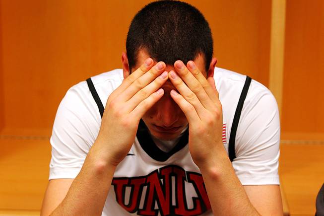 UNLV guard Karam Mashour rests his head in his hands after losing to Illinois 73-62 in the second round of the NCAA basketball championships on Friday, March 18, 2011, at the BOK Center in Tulsa. 