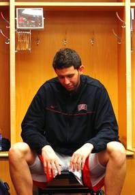UNLV forward Carlos Lopez sits in the locker room after their 73-62 loss to Illinois in the second round of the NCAA basketball championships Friday, March 18, 2011, at the BOK Center in Tulsa.