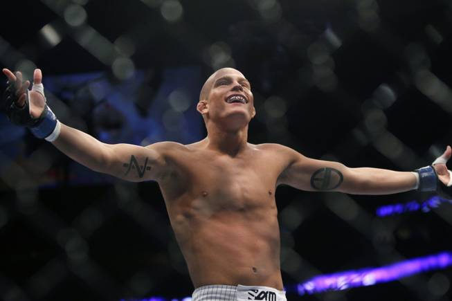 Erik Koch celebrates his first-round win over Raphael Assuncao in their mixed martial arts match at UFC 128  Saturday, March 19, 2011 in Newark, NJ.
