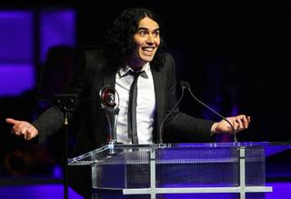 British actor Russell Brand accepts his award for Comedy Star of the Year during CinemaCon, the official convention of the National Association of Theatre Owners, at Caesars Palace March 31, 2011.