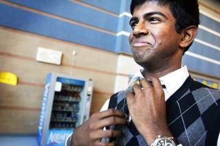 Green Valley High School forensics team member and junior Bharani Thenappan, 17, adjusts his tie before a match at Siera Vista High School in Las Vegas Friday, April 1, 2011.