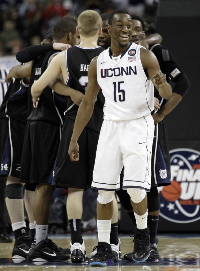 Connecticut's Kemba Walker reacts in the final minute against Butler at the men's NCAA Final Four college basketball championship game Monday, April 4, 2011, in Houston. Connecticut won 53-41.