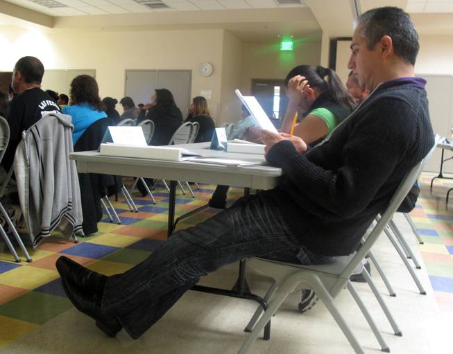 A student reads his notes during a Hispanic Citizens Academy class at the Pearson Community Center. At this Hispanic Citizens Academy, the eighth so far of the program's history, North Las Vegas Police are training under Metro Police officers to expand the program in their jurisdiction.
