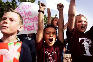 Andrew Piotrowski, 9, from left, Lincoln Aquino, 9, and Alexis Almeido, 11, all students at Glen Taylor Elementary School, rally to encourage the governor and Legislature to support education at Glen Taylor Elementary School in Henderson Wednesday, April 13, 2011.