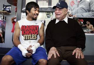 Filipino boxer Manny Pacquiao shares a laugh with comedian Don Rickles during a workout at the Wildcard Boxing Club in Hollywood Thursday, April 21, 2011. Pacquiao is preparing for his upcoming welterweight fight against 
