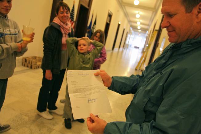 Greg Korte, who runs a general contracting company in Las Vegas, swung past Sen. John Ensign's office with his wife Nicole and their three kids Friday to pick up Senate floor passes they'd been promised in a letter from Ensign. They were surprised to discover the senator's office closed for Good Friday -- and that he'd resigned a day earlier.