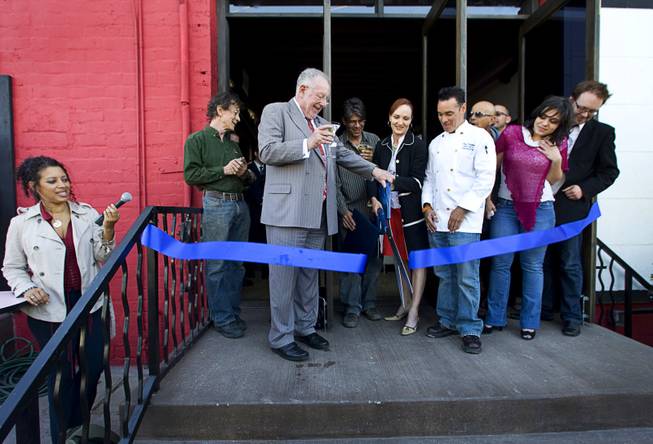 Mayor Oscar Goodman, left, helps cut a grand opening ribbon ...