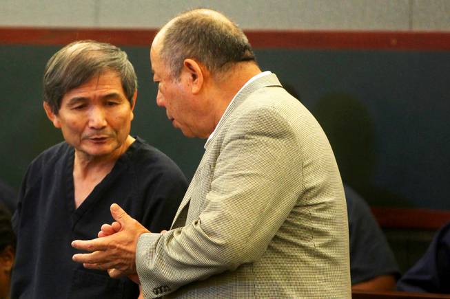 Hiroyuki Yamaguchi appears in court Tuesday morning, April  26, 2011, with an interpreter at the Regional
Justice Center on charges stemming from the  Feb. 24, 2011, Rio robbery.