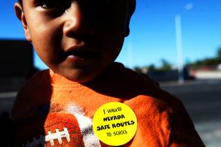 Stickers are passed out to those participating in the second annual Nevada Moves Day in front of Arturo Cambeiro Elementary School in Las Vegas Wednesday, April 27, 2011.