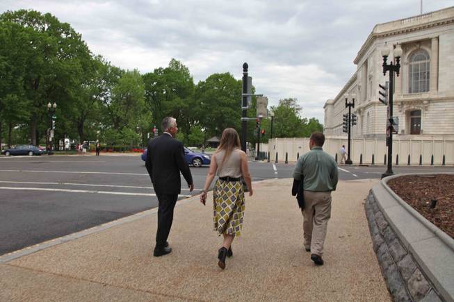 Sen. John Ensign and two members of his staff walk back toward the Russell Senate Office Building, where Ensign's offices are located, after a taking a round of office pictures on the steps of the Senate at the Capitol in Washington, D.C., on Thursday, April 28, 2011.