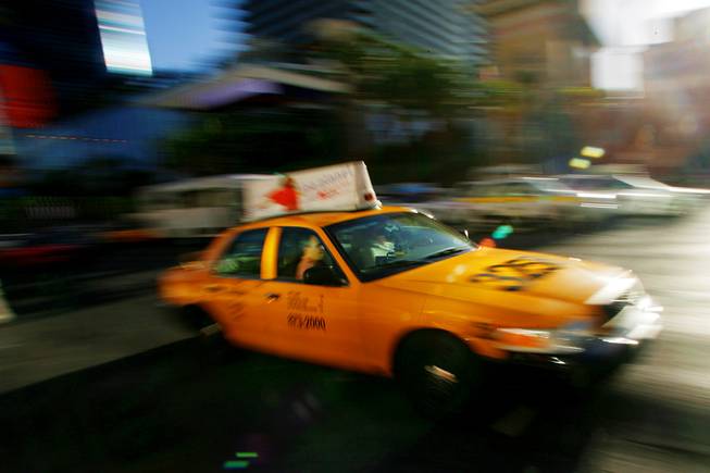A taxi cab drives down the Strip Thursday, April 28, 2011.