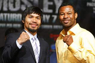 Boxers Manny Pacquiao, left, of the Philippines and Shane Mosley of Pomona, Calif. pose during a news conference at the MGM Grand Wednesday, May 4, 2011. Pacquiao will defend his WBO welterweight title against Mosley at the MGM Grand Garden Arena on Saturday.