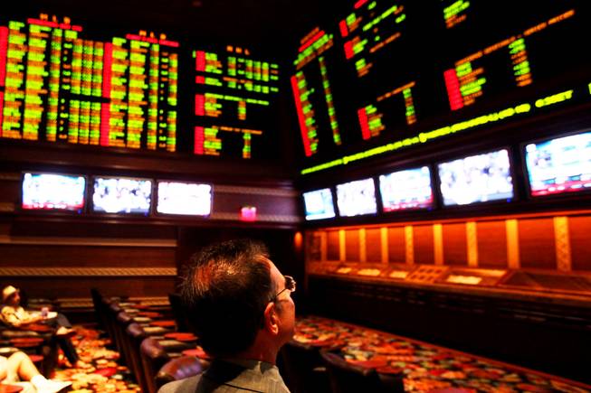Race and sports book director Johnny Avello checks the screens at the sports book at Wynn Las Vegas on Wednesday, May 4, 2011.