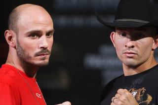 Former middleweight champion Kelly Pavlik, left, of Youngstown, Ohio and Alfonso Lopez of Cut and Shoot, Texas, pose during a news conference at the MGM Grand Thursday, May 5, 2011. Pavlik is attempting a comeback after checking into rehab for alcohol issues last year. The boxers are scheduled for a 10-round super middleweight undercard bout at the MGM Grand Garden Arena Saturday.
