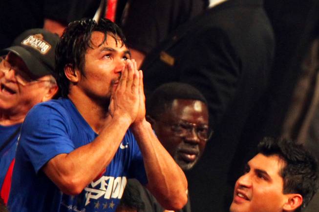 Manny Pacquiao celebrates his unanimous decision win over Shane Mosely to keep the WBO world welterweight title at MGM Grand Garden Arena Saturday, May 7, 2011.