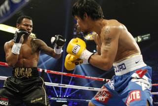 Shane Mosley fights Manny Pacquiao during their WBO welterweight title fight at the MGM Grand Garden Arena on May 7, 2011.