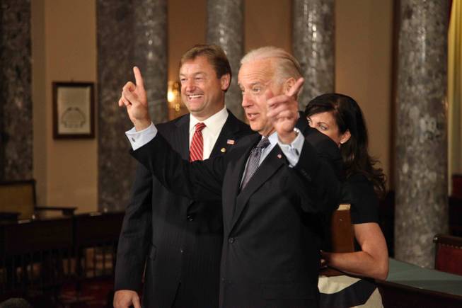 Vice President Joe Biden, just before re-enacting Sen. Dean Heller's swearing-in in the Old Senate Chamber in the Capitol on May 9, 2011, jokes that the furthest distance in Washington is between the House and Senate.