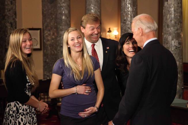 Vice President Joe Biden jokes with Sen. Dean Heller's family after a mock swearing-in in the Old Senate Chamber in the Capitol on May 9, 2011. Heller's oldest daughter, Hilary Ableser, 25, center, and her husband Eddie, 33, not pictured, are expecting Dean and Lynne Heller's first grandchild in late October. Also pictured, left: Heller's younger daughter Emily, 15.