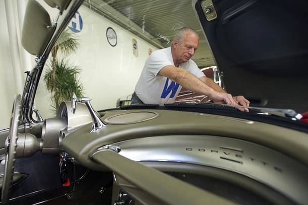 Auto technician Bob Dehnert works on a 1961 Chevrolet Corvette Roadster at the Auto Collections at the Imperial Palace Monday, May 16, 2011.