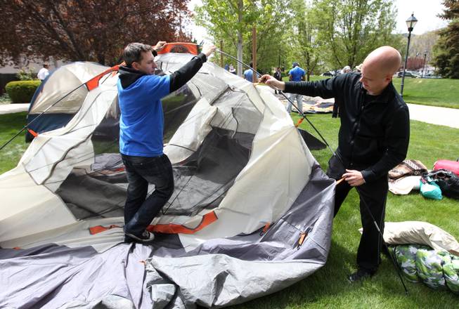 Protesters J.T. Creedon, left, and Tyler Egeland set up a tent Monday, May 16, 2011, at the Legislature in Carson City, Nev. About 60 people are expected to participate in a three-day event organized by advocates who support a Democratic tax package.
