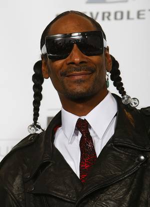 Rapper Snoop Dogg poses on the photo room  during the Billboard Music Awards Show at the MGM Grand Garden Arena Sunday, May 22, 2011.