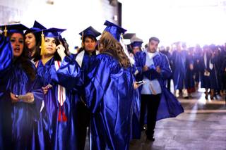 Astrid Silva stands in line, waiting for the commencement ceremony for the College of Southern Nevada at the Thomas & Mack Center in Las Vegas Monday, May 23, 2011.