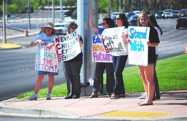 About 50 teachers, students and parents from Bob Miller Middle School, Mannion Middle School and Silverado High School gathered in front of The District at Green Valley Ranch in Henderson on Wednesday, May 25, 2011 to protest the education budget cuts. 