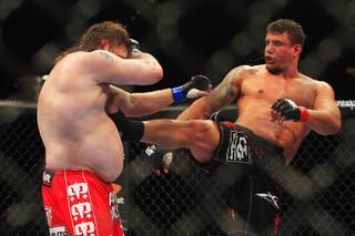 Frank Mir hits Roy Nelson with a kick during their bout at UFC 130 Saturday, May 28, 2011 at the MGM Grand Garden Arena. Mir won by decision.