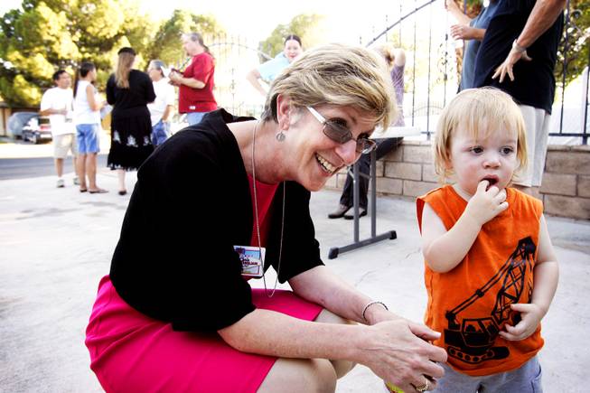 Las Vegas mayoral candidate Chris Giunchigliani says hello to 18-month-old Michael DeBerg during a campaign stop at a downtown barbecue Wednesday, June 1, 2011.