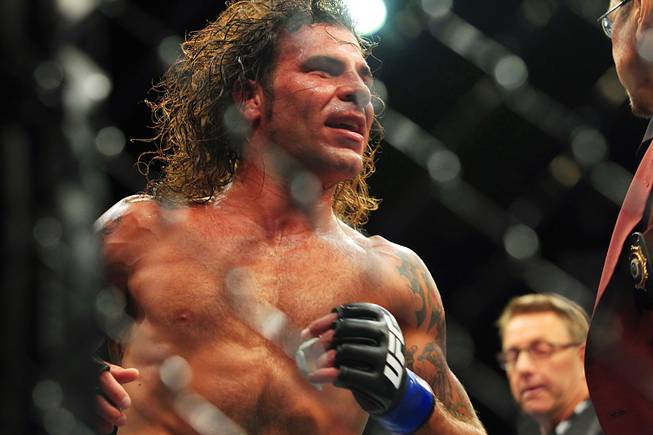 Clay Guida takes a lap around the octagon after defeating Anthony Pettis in their bout at The Ultimate Fighter Season 13 finale Saturday, June 4, 2011.