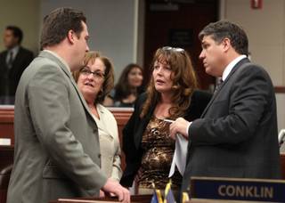 Nevada Assembly Democrats, from left, Speaker John Oceguera, Debbie Smith, Marilyn Kirkpatrick and Marcus Conklin, talk on the Assembly floor Monday, June 6, 2011, at the Legislature in Carson City.