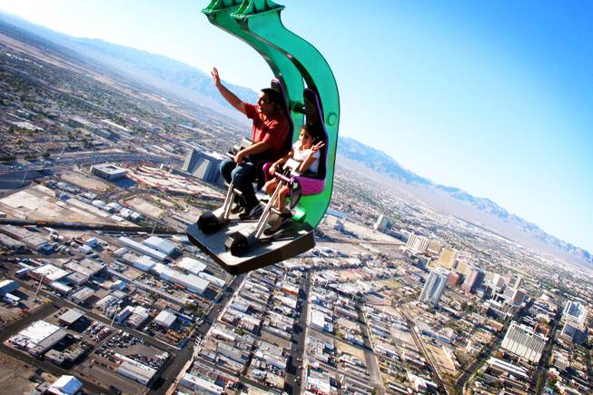 Taahira Bhalla, 9, and her uncle Kapil Rajpad of New Delhi, India, ride Insanity at the top of the Stratosphere in Las Vegas Tuesday, June 7, 2011.