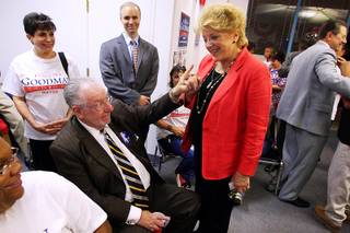 Las Vegas Oscar Goodman points to his wife, mayoral candidate Carolyn Goodman, as early returns show her with a sizable lead during an election night party at her campaign headquarters Tuesday, June 7, 2011.