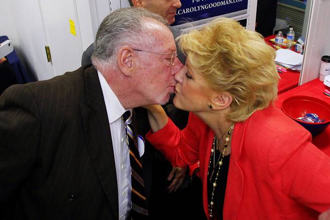 Las Vegas mayoral candidate Carolyn Goodman gets a kiss from her husband, current mayor Oscar Goodman, after the race was called in her favor Tuesday, June 7, 2011.