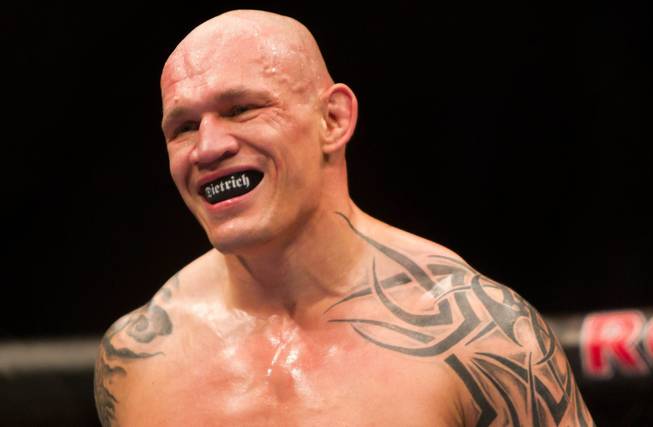 Canada's Krzysztof Soszynski, of Winnipeg, Man., smiles during his fight against Mike Massenzio, of Paterson, N.J., in a light heavyweight mixed martial arts bout at UFC 131, Saturday, June 11, 2011, in Vancouver, British, Columbia.