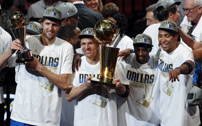 Former Rebel Shawn Marion, far right, celebrates an NBA title with his Dallas Mavericks teammates on Sunday evening in Miami. Marion, who played at UNLV in the 1989-99 season, scored 12 points in the series-clinching 105-95 victory over the Miami Heat. In the process, he became the first UNLV player to win an NBA title since 1972.
