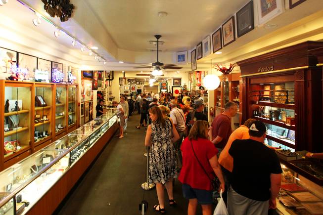 Visitors browse Gold & Silver Pawn in Las Vegas on Wednesday, June 15, 2011. The shop is the home to the reality TV show "Pawn Stars" on The History Channel.